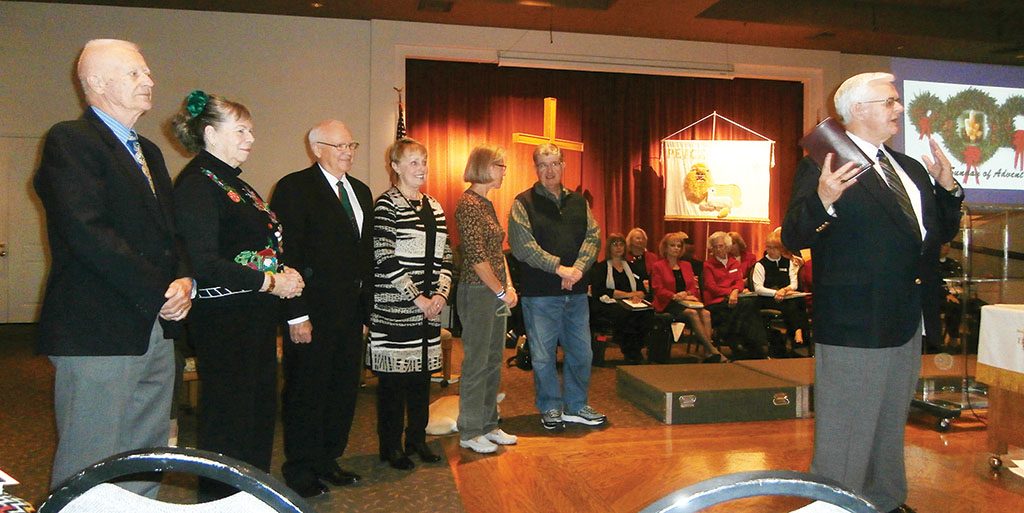 Left to right: Ken and Lenore Semmler, Barbara and Jim Grimm and Joe and Liz Arnold. Officiating is Pastor Dennis Kizziar.