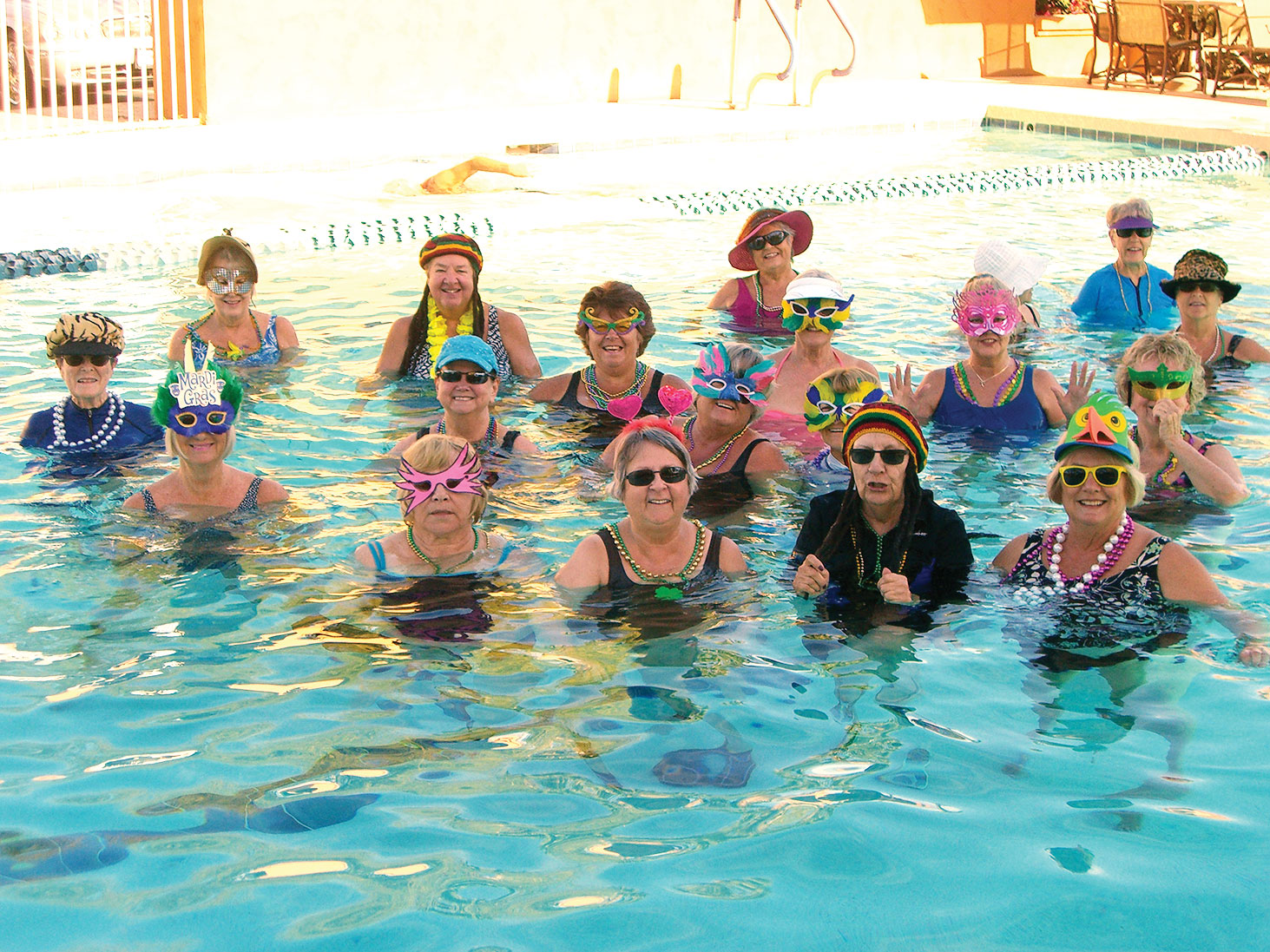 The 7:00 and 10:00 a.m. Water Fitness classes celebrate Mardi Gras in style by wearing beads, masks and many special hats.