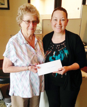 Barbara Weckworth receives the February PebbleCreek comment card gift certificate from Melissa Gonzales.