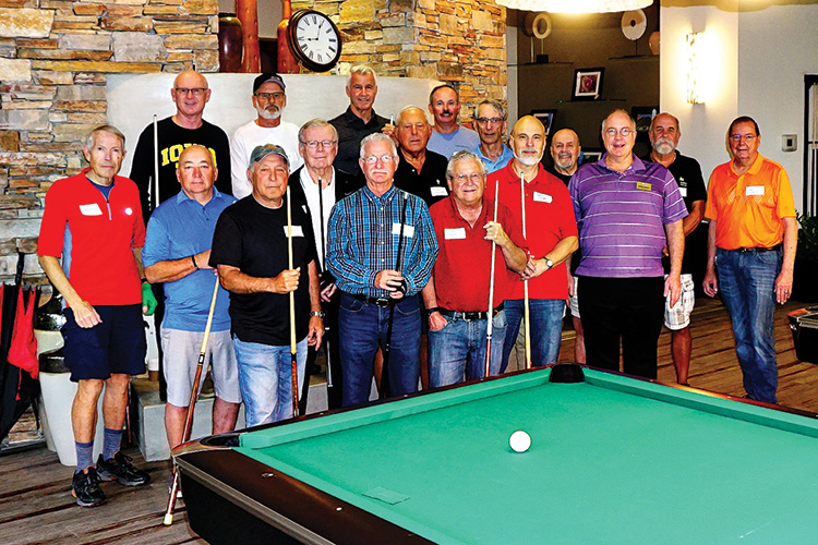 Billiard Club members Lynn (photographer), Jim, Rene, Jim P., Ken, Brian, and Johnny pose with Vistancia players prior to an inter-community 8-ball match on March 12.