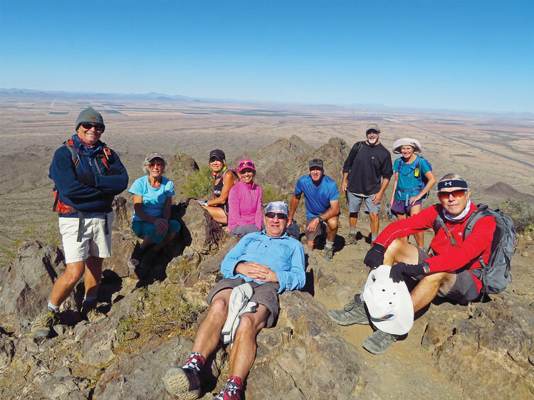 From left: Neal Wring, Vicki Carter, Kris Raczkiewicz, Marilyn Reynolds, Bill Halte, Clare Bangs, Leon and Eileen Mosse, and Lynn Warren (photographer) relaxing after a leisurely lunch on the summit of Picacho Peak.