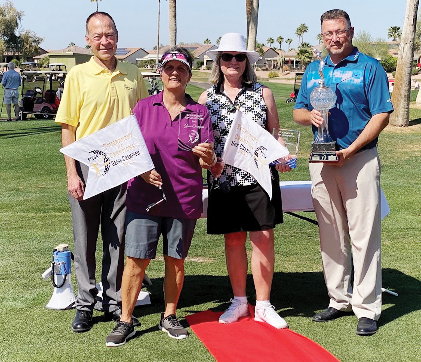Left to right: Head Pro John McCahan, Gross Champion Andrea Dilger, Net Champion Diana Hull, and Pro Ronnie Decker