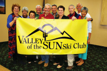 Left to right: Nancy Adams, Jane Sweet, Rose Geller, Ted McGovern, Lew Geller, Dave Geurden, Sharon Geurden, Lynn Warren, Jim Jarvis and Carol Jarvis hold the newly designed club banner.