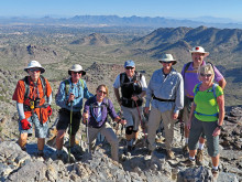 Left to right: Lynn Warren, Jim Gillespie, Bonnie Elliott, Bill Baxter, Les Reister, Steve Duncanson and Julie Walmsley perched above the east valley on Piestewa Peak.