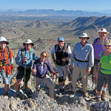 Left to right: Lynn Warren, Jim Gillespie, Bonnie Elliott, Bill Baxter, Les Reister, Steve Duncanson and Julie Walmsley perched above the east valley on Piestewa Peak.