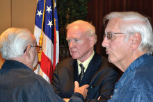 Donald Critchlow, center, meeting with members after the program.