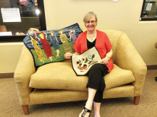 Sally Holmboe with her finished rugs.