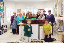 Rug Hookers at Workshop, back row left to right: Karen Bogadi, Leslie Russell, Sally Holmboe, Mardelle Widmer and Karen Lubahn; front: Debbie Liotti, Monika Jones, June Bennett, Dottie Eaton and Barb Mauer; kneeling: Kathy Garner and Linda Schmidt; photo by Gail Hock