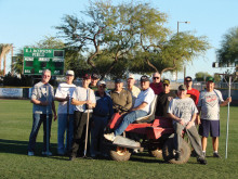 Those players who participated in the latest upkeep of the complex include, left to right: Vince Richey, Larry Tanner, Don Belonax, Steve Peterson, Bob Quarantino, Rich Christiansen, Lee Ayers, Lyman Rinehart (on tractor), Steffen Jacobson, Jim Beyers, Chuck Johnson, Jan Hangen and Director of Field Maintenance Doug Wainwright.