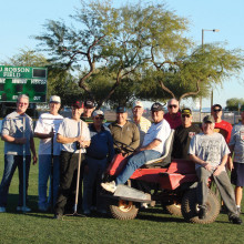 Those players who participated in the latest upkeep of the complex include, left to right: Vince Richey, Larry Tanner, Don Belonax, Steve Peterson, Bob Quarantino, Rich Christiansen, Lee Ayers, Lyman Rinehart (on tractor), Steffen Jacobson, Jim Beyers, Chuck Johnson, Jan Hangen and Director of Field Maintenance Doug Wainwright.