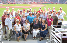 Neighbors pose after a Milwaukee win at Goodyear Ballpark.