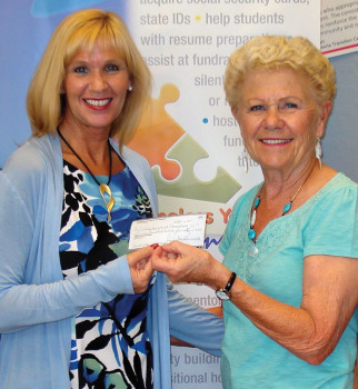 Jan Howard, project coordinator, presenting the check to Ms. Bogart