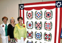 WWI Quilt, left to right: Jan Johnson and Erma Taylor (co-chairs); quilted by Cindy Santoro