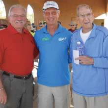 HOA President John Kiekbusch (left) and the pickleball club’s founder and first President Grover Lumbard (right) cut the ribbon to open the tournament. Current President Mike Crabtree (center) was master of ceremonies.