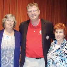 Ron Sites, president/executive director of the Luke AFB Fighter Country Partnership (FCP), poses with Judy Shaffer, left, president of the PC Singles Club and member Elizabeth Stelton who nominated the FCP for consideration as one of the club’s 2015 charities. Mr. Sites awarded the two ladies a special Luke AFB medallion to recognize support for local military families.