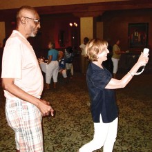 Debbie Svoboda being coached by Wii Bowling Master Jerome Sims