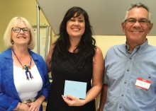 Guylene Ozlanski, Arts and Culture Coordinator for Goodyear, accepts a donation from Charlene Romanos, 2015 Art Walk Co-Chair and Charles Peterman, 2015 Meet the Arts Chair.