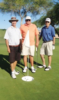 Goofy Golf participants at pizza-size cup at 16th hole (left to right) Bob LeClair, Steffen Jacobson and Don Morris