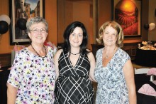 Residents Vickie Hamilton (left) and Kathy Veleta (right) celebrate with Candice Pakitsos, PebbleCreek Food & Beverage Catering Manager, who is expecting a baby girl the first week of July!