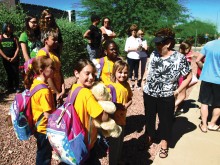 Five of our campers with our camp chairman, Sandy Blackburn, waiting to get on the bus to camp.