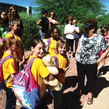 Five of our campers with our camp chairman, Sandy Blackburn, waiting to get on the bus to camp.