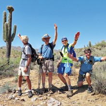 Left to right: Clare Bangs, Pete Williams, Lynn Warren (photographer) and Bill Halte clowning for a selfie with a crested saguaro in the McDowell Sonoran Preserve.