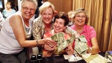 Money, money, money, life is sunny when you win the PC Singles Summer Pub Quiz Bonus Round. Members of the Board Beauties team, Peggy Kuffner, Pat Milich, Anita Asp and Judy Shaffer count their winnings at the July Pub Quiz event.