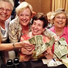 Money, money, money, life is sunny when you win the PC Singles Summer Pub Quiz Bonus Round. Members of the Board Beauties team, Peggy Kuffner, Pat Milich, Anita Asp and Judy Shaffer count their winnings at the July Pub Quiz event.