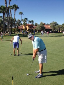 Cliff Olson prepares to sink a putt.