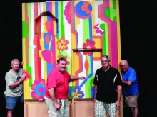 Joe Wallace, Bill Silverman, Joe Salerno and Mike Ramsey construct PebbleCreek’s own Laugh-In joke wall for A Night at the Renaissance.