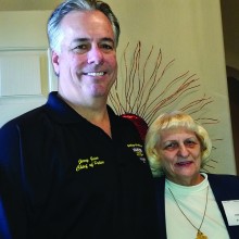 Goodyear Chief of Police Jerry Geier and Hostess Barbara Mailloux greet guests at PebbleCreek Home Tour.