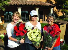Debbie Svoboda, Betty Thompson and Sharon Duncan show the fundraising poinsettias.