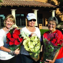 Debbie Svoboda, Betty Thompson and Sharon Duncan show the fundraising poinsettias.