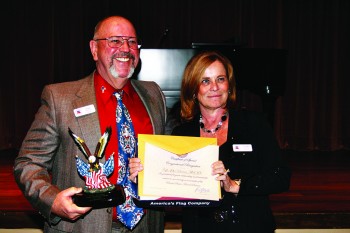 1915 Honoree Award presented to Chaplain John Parsons by President Linda Migliore