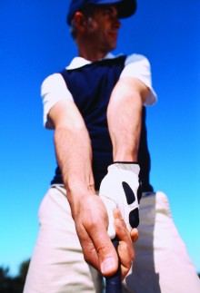 Low angle view of a man holding a golf club