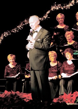 Mr. Hayes shares his light hearted sense of humor with the audience during the PC Singers’ Holiday Concert, also thanking Gail Kennedy for her hard work preparing the chorus in advance of his visit.