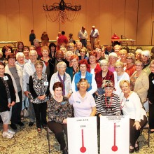 Proud and happy members of the PebbleCreek Singles Club gather around President Judy Shaffer and other members of the Board of Directors after learning that the $5000 fundraising goal for the 2015 Charitable Campaign had not only been reached, but exceeded.