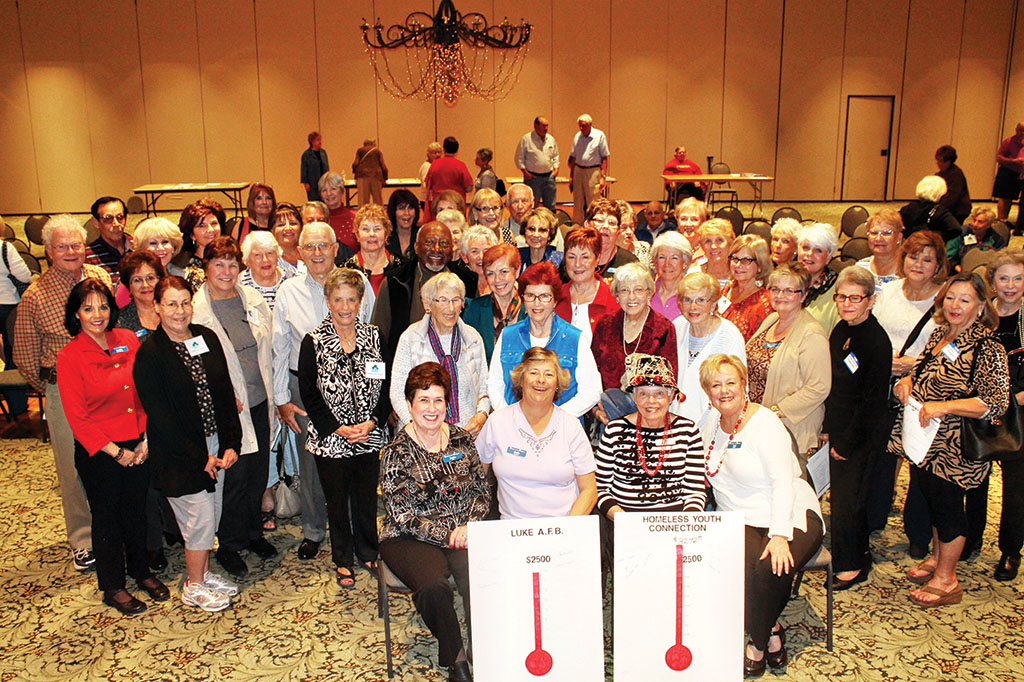 Proud and happy members of the PebbleCreek Singles Club gather around President Judy Shaffer and other members of the Board of Directors after learning that the $5000 fundraising goal for the 2015 Charitable Campaign had not only been reached, but exceeded.