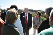 Don Chealander, center, chats with tour members outside the Reagan Library.