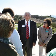 Don Chealander, center, chats with tour members outside the Reagan Library.