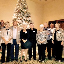 PCM9GA President and guests at holiday party, left to right: Luanne Brown, JoAnne Clements, PCM9GA President Ray Clements, Sandy Wold, Pat Moore, Maryanne Skirnick, Doug Wainwright, Linda Shaver