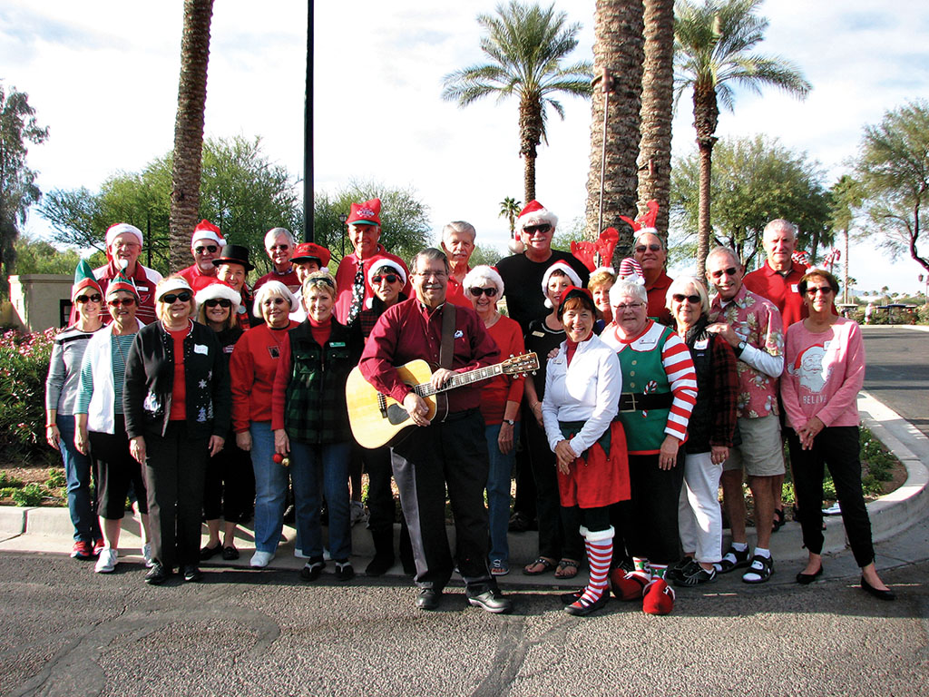 Rod and Linda Grabau’s group had two of Santa’s Elves join the carolers.
