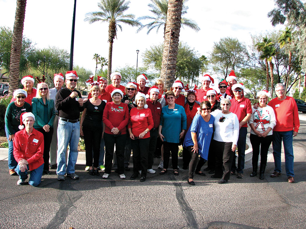 Jerry and Sue White’s group had the most carolers with Santa hats.