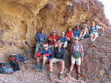 Left to right, front: Lynn Warren (photographer), Tom Wellman, Gary Bray; rear: Mark Frumkin, Steve Duncanson, Les Reister, Nancy Love, Jim Gillespie, Julie Walmsley and Clare Bangs sheltered from a cool breeze by a large overhang next to the double arches.