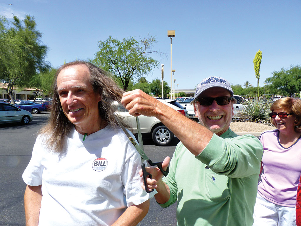 Joking around with their friend and fellow PebbleCreek bocce player, Bill Wright and Vivian Klick threaten to cut off William Moser’s long locks with a pair of giant scissors. Also on hand to witness William’s haircut were friends and fellow bocce players Joe and Carolyn Rota, Kenneth and Carrie Cina and Roger Milewski.