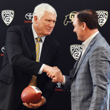 Herb Orvis, the seventh University of Colorado football player set for induction into the College Football Hall of Fame, with CU Athletic Director Rick George during the recent National Signing Day for athletes in Boulder, Colorado.