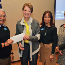 Jan Cosgrove, President of the Association, accepted a $1,000 check for Southwest Valley Literacy.