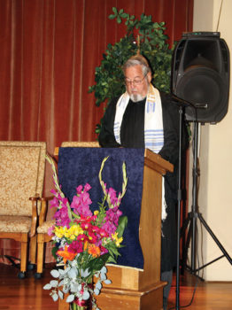Rabbi David Mayer reading from the Torah