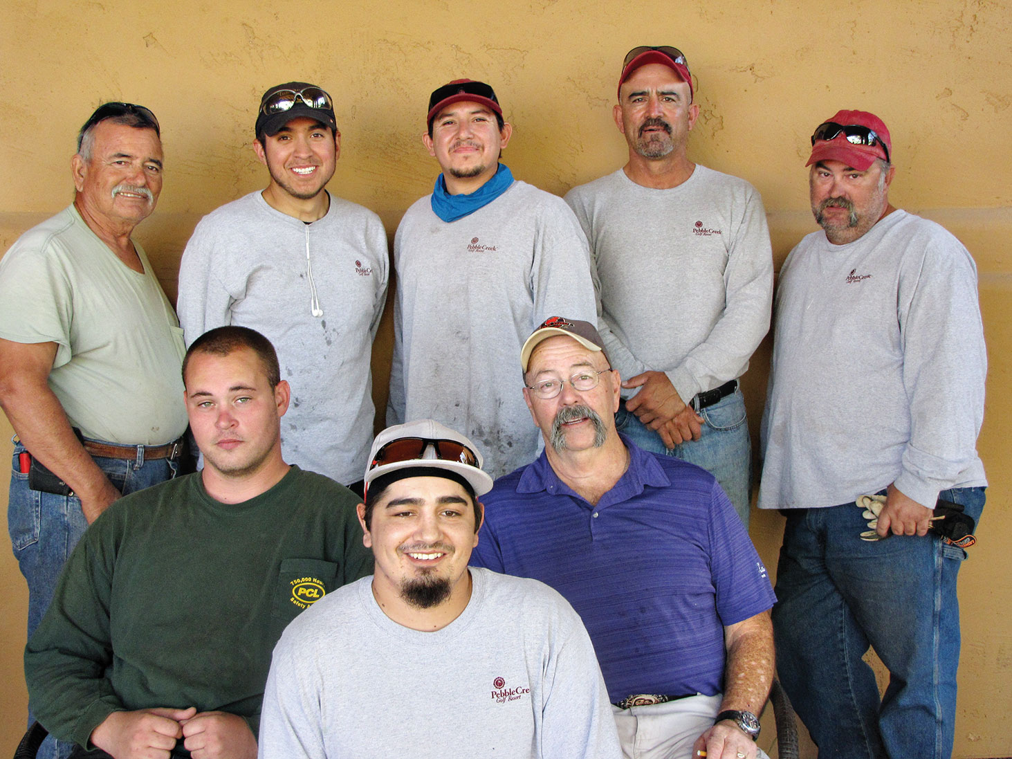 Ron Sawyer (seated on right) with some of his landscaping crew