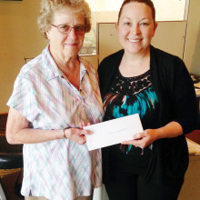 Barbara Weckworth receives the February PebbleCreek comment card gift certificate from Melissa Gonzales.